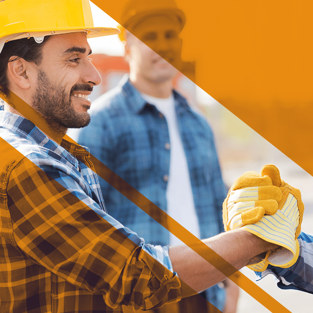 man shaking hands with coworker wearing hardhat