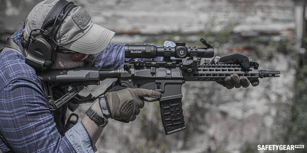 man with gun and shooting glasses