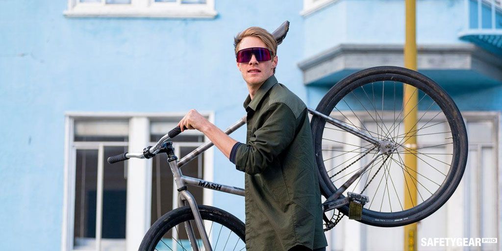 Man wearing Oakley prescription sunglasses in carrying bike