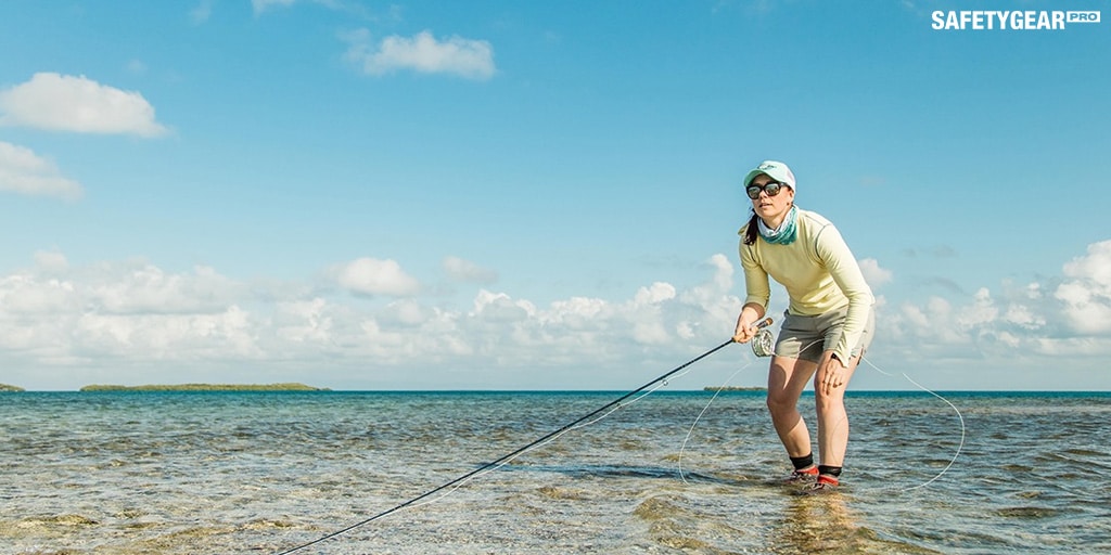 Woman fishing with costa sunglasses