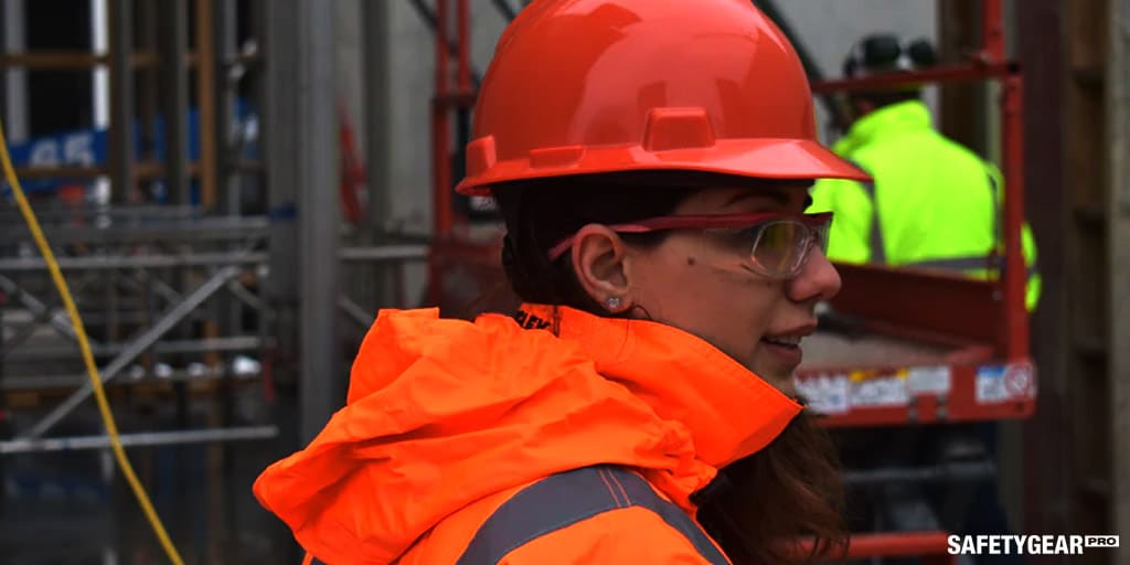 woman wearing hard hat and glasses