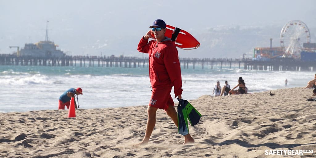 Lifeguard walking by the beach