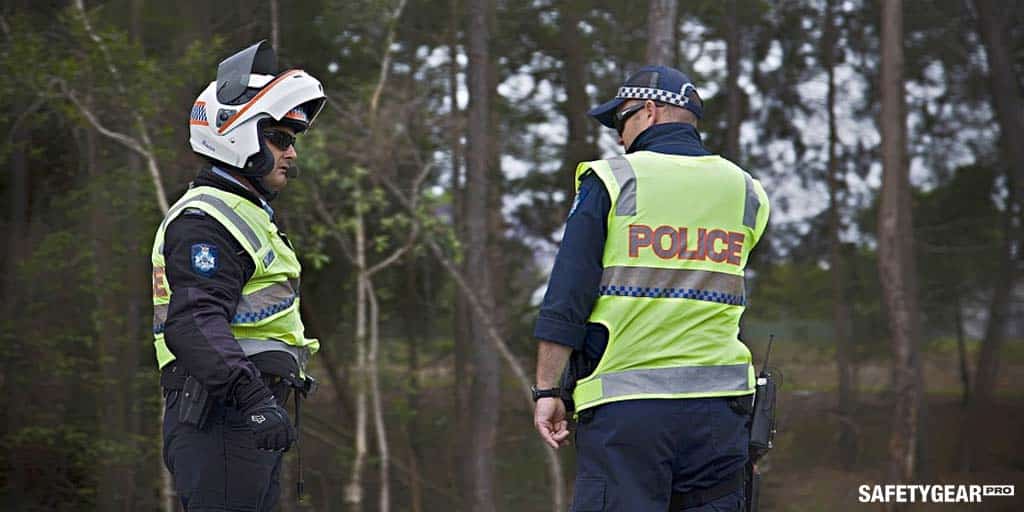 Police officers talking with special police sunglasses