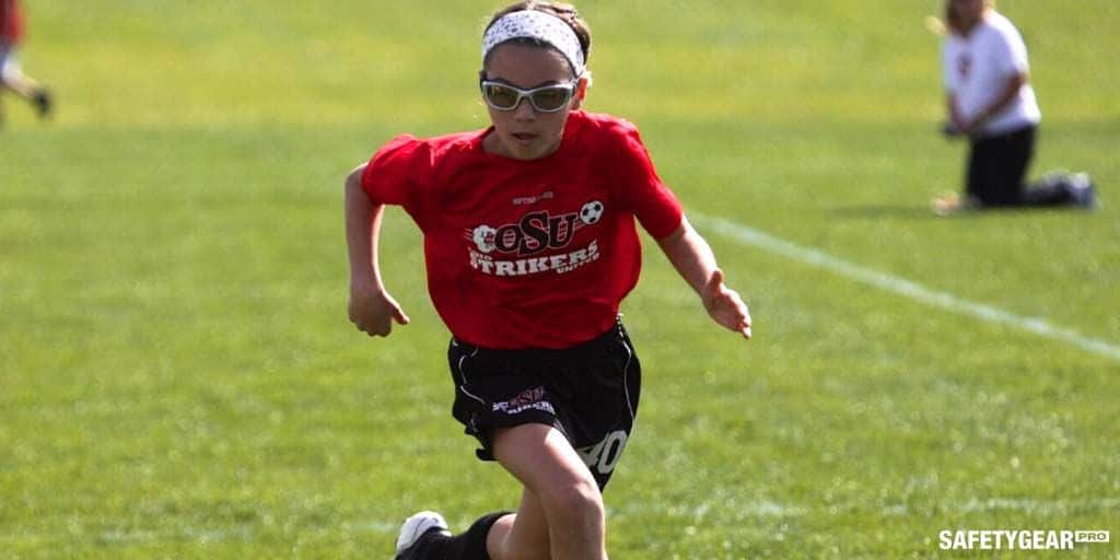 man wearing glasses while playing sports