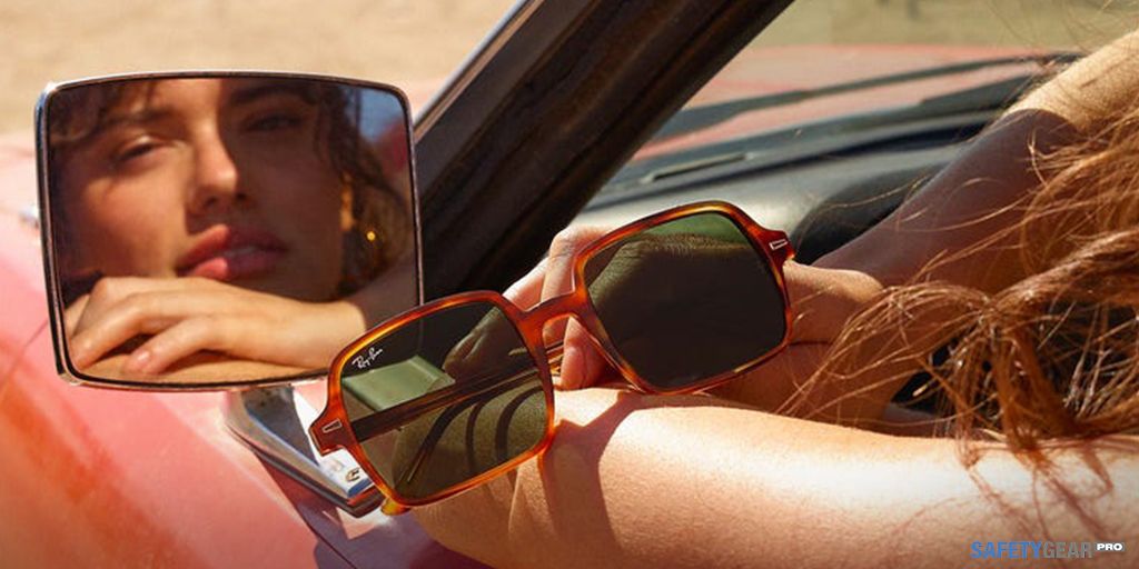 woman in a car holding Ray-Ban Sunglasses