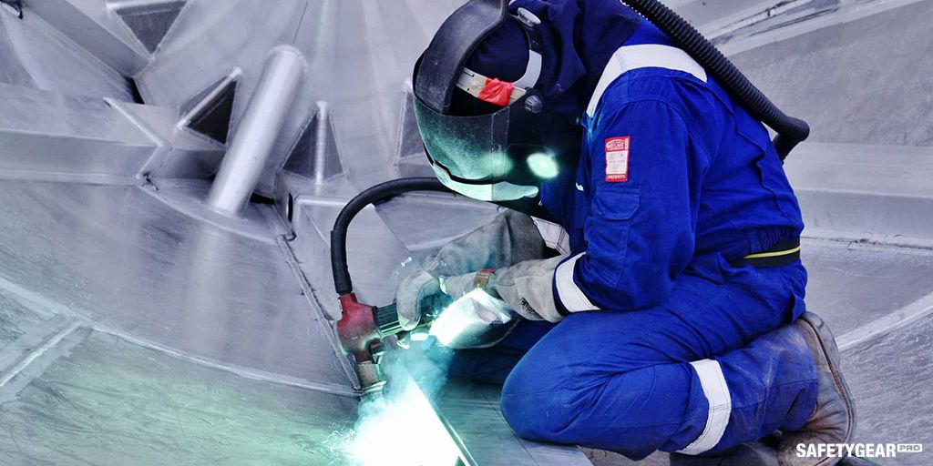 welder using welding glasses while working
