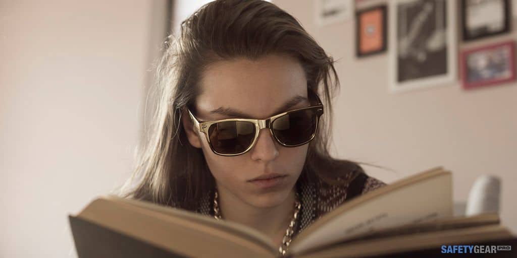 woman wearing polarized prescription sunglasses while reading