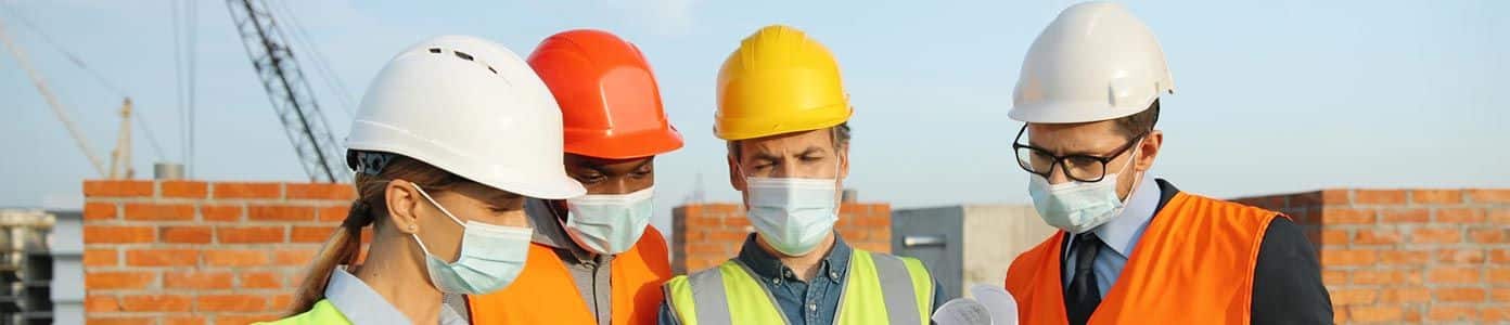 construction workers wearing hard hats