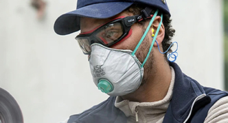 worker wearing prescription safety glasses with straps