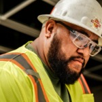 Man wearing prescription safety glasses in an industrial environment
