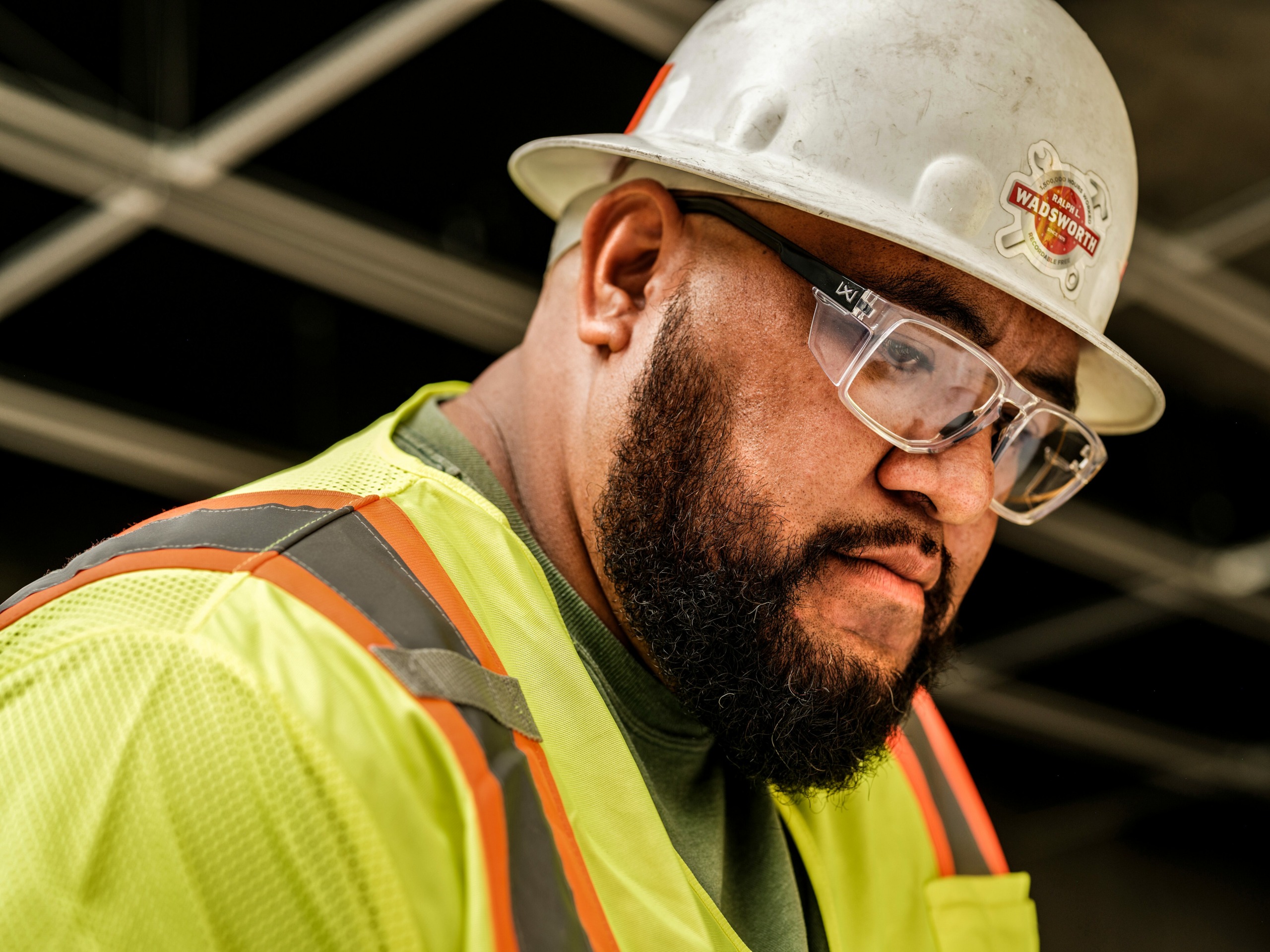 Man wearing hard hat and high visibility vest safety equipment