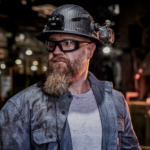 Man Wearing Wrap Around Safety Glasses for Work